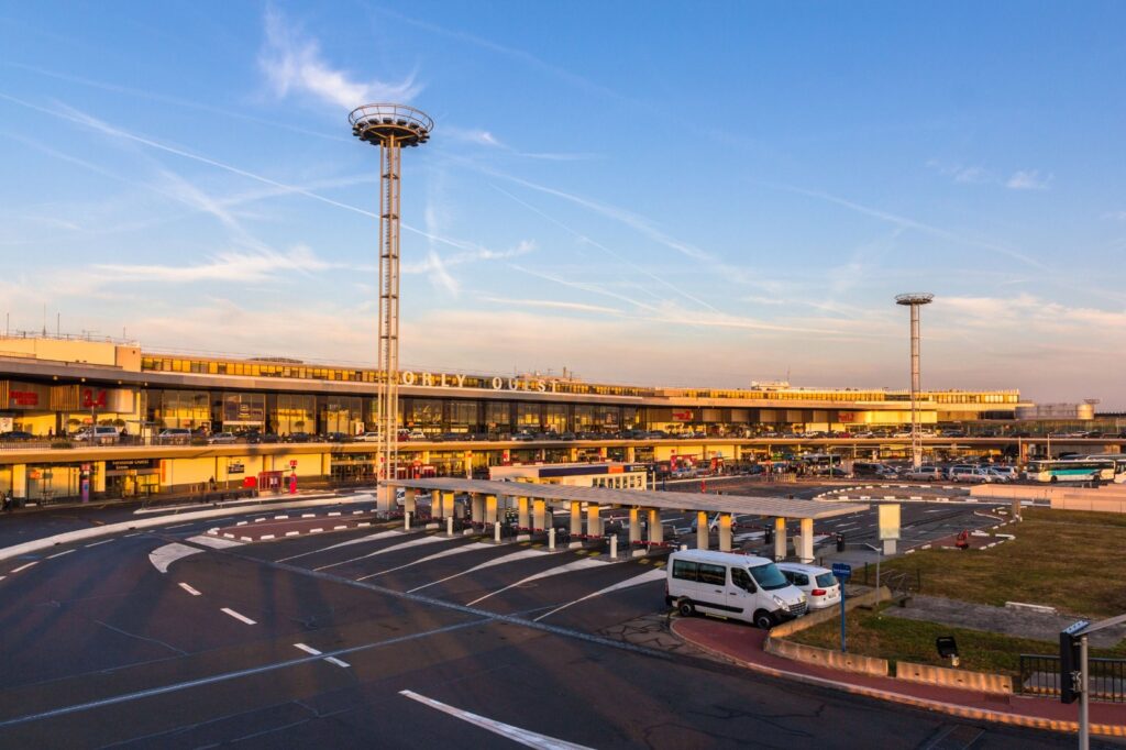 Airport terminal and control tower with a shuttle van
