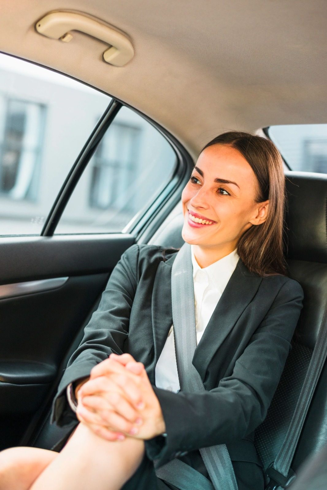 Relaxed passenger in the back seat of a taxi