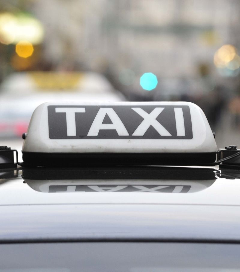 Illuminated taxi sign on a car roof