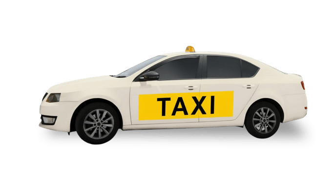 White taxi with a yellow TAXI sign